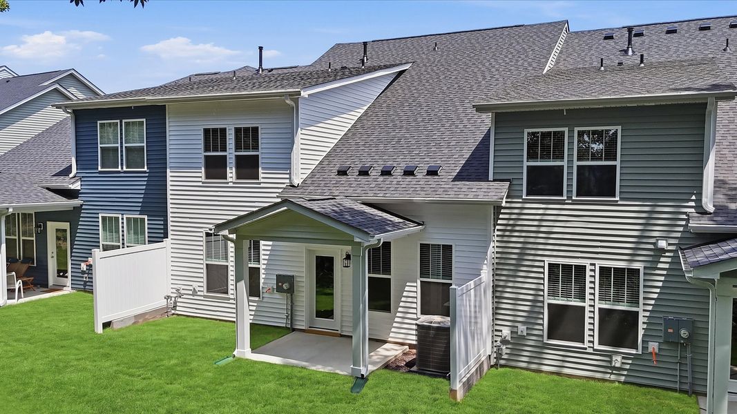 Highly functional rear covered porch adds memorable living space to this elegant home