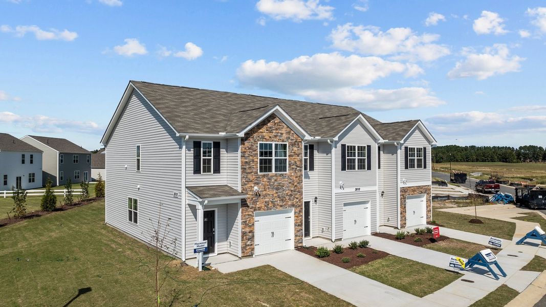 Front exterior of a new home in The Townes at Ridgewood Farms, Winterville, NC, highlighting curb appeal (Image 22).