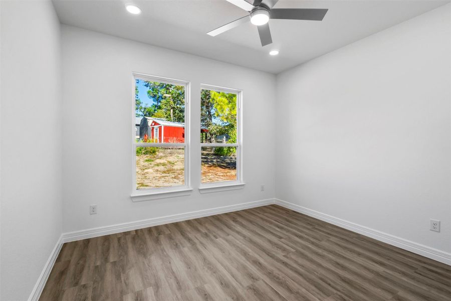 Unfurnished room with wood finished floors, recessed lighting, and ceiling fan