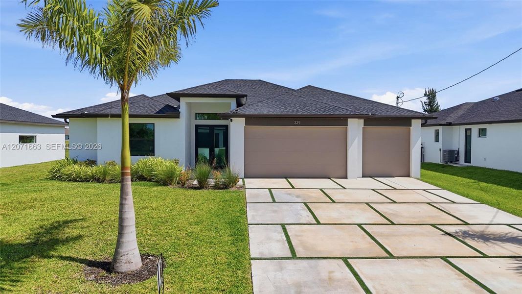 Front exterior of a new home in , Cape Coral, FL, highlighting curb appeal (Image 2). Front exterior of a new home in , Cape Coral, FL, highlighting curb appeal (Image 2).