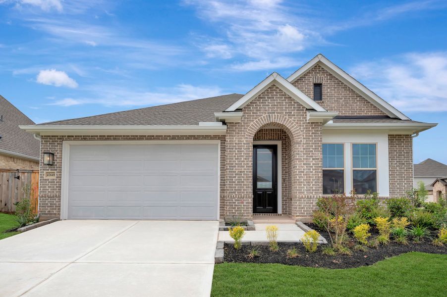 Front exterior of a new home in Escondido - Retreat Collection, Magnolia, TX, highlighting curb appeal (Image 1). Front exterior of a new home in Escondido - Retreat Collection, Magnolia, TX, highlighting curb appeal (Image 1).
