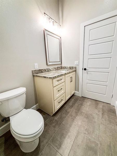 Bathroom with vanity and baseboards Bathroom with vanity and baseboards