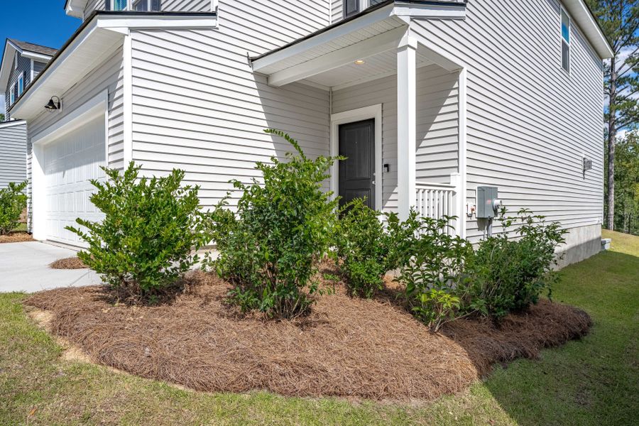 Exterior details and patio area of a home in Grand Arbor, Blythewood (Image 33).