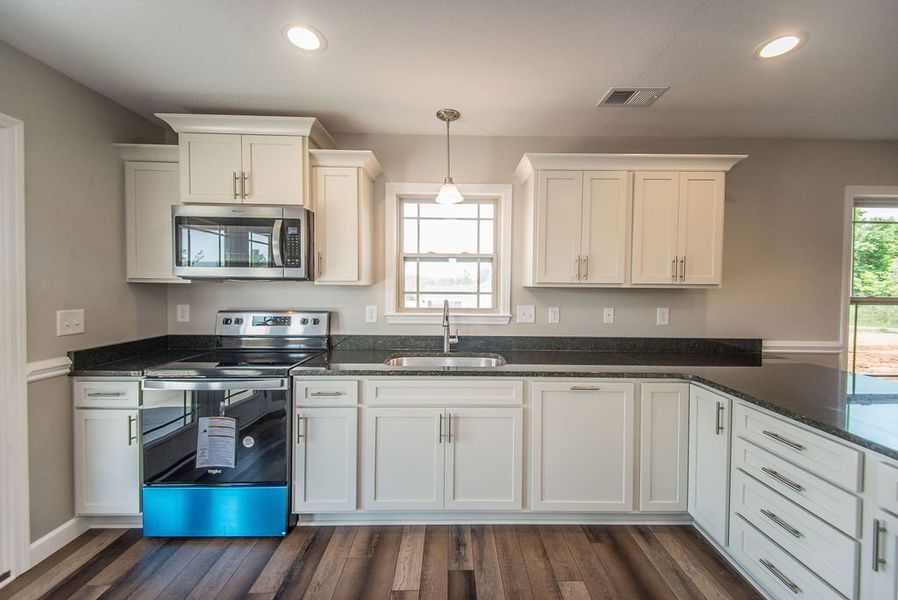 Representative furnished interior of a home built from the Pacific by Enchanted Homes in Hampshire Heights, Moore (Image 15).