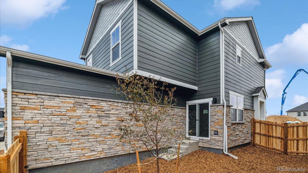 Exterior details and patio area of a home in Horizon Uptown, Aurora (Image 3).