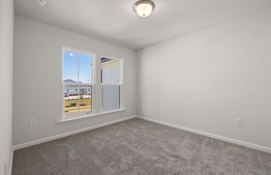 Spacious, unfurnished interior of a new home in Saunders Farm, Willow Spring (Image 21).