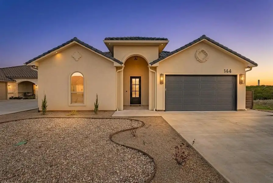 Front exterior of a new home in , Glen Rose, TX, highlighting curb appeal (Image 1). Front exterior of a new home in , Glen Rose, TX, highlighting curb appeal (Image 1).