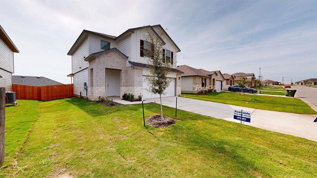 Front exterior of a new home in Pecan Creek, Temple, TX, highlighting curb appeal (Image 20). Front exterior of a new home in Pecan Creek, Temple, TX, highlighting curb appeal (Image 20).