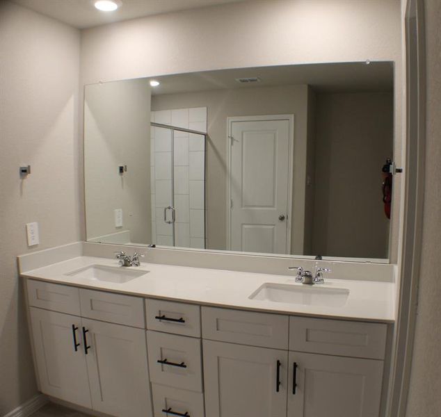 Quartz counters with dual sinks in primary bath. Quartz counters with dual sinks in primary bath.
