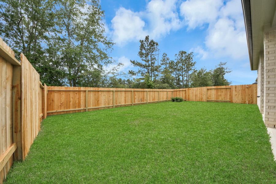 Backyard retreat, offering an abundance of space for kids to play and explore. The possibilities are endless in this outdoor haven, where the joy of open-air activities and family gatherings awaits.