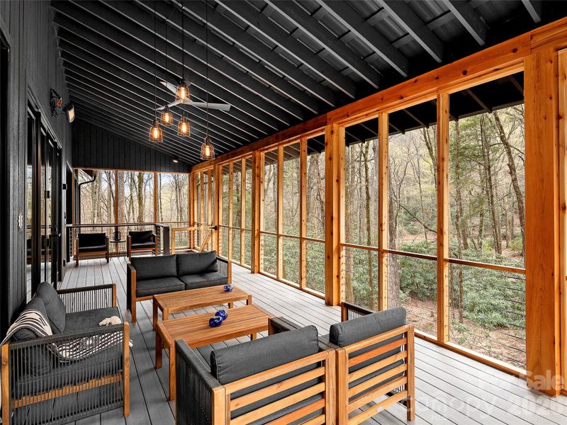 Enjoy the sound of the creek from the screened in and heated back porch Enjoy the sound of the creek from the screened in and heated back porch