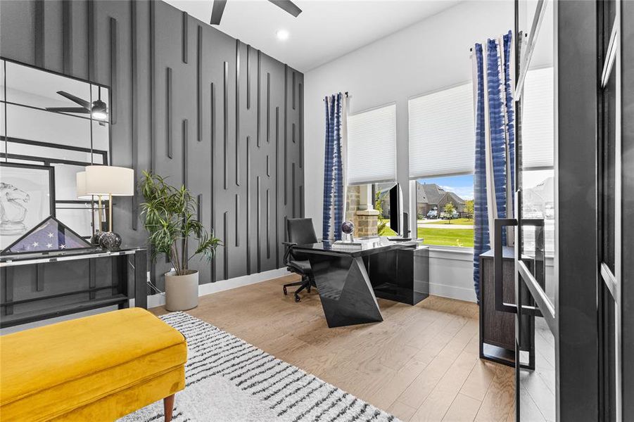 Office area with a ceiling fan, light wood finished floors, and recessed lighting