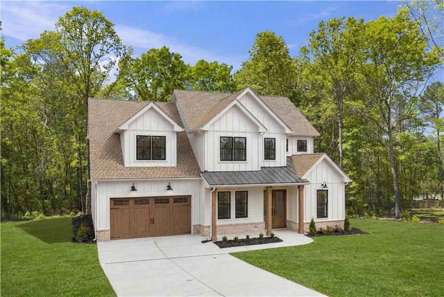 Front exterior of a new home in , Cumming, GA, highlighting curb appeal (Image 2). Front exterior of a new home in , Cumming, GA, highlighting curb appeal (Image 2).