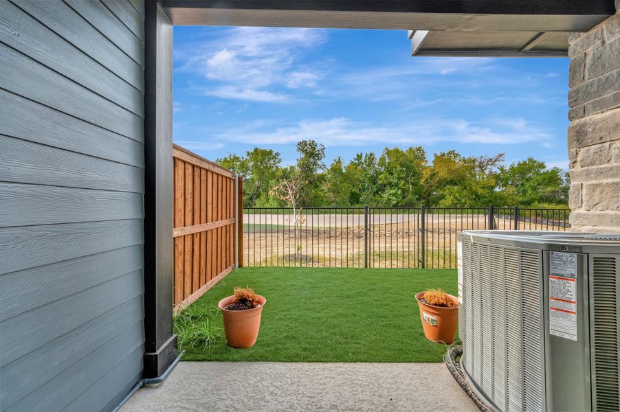 Exterior details and patio area of a home in Trails at Waterside - Villas Series, Fort Worth (Image 4).