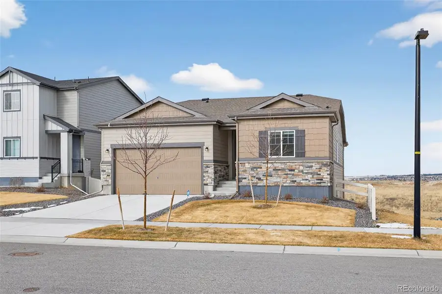 Front exterior of a new home in Anthology North, Parker, CO, highlighting curb appeal (Image 21).
