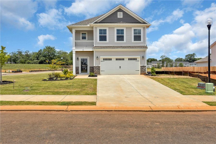 Front exterior of a new home in Brownstone Park, Easley, SC, highlighting curb appeal (Image 12).