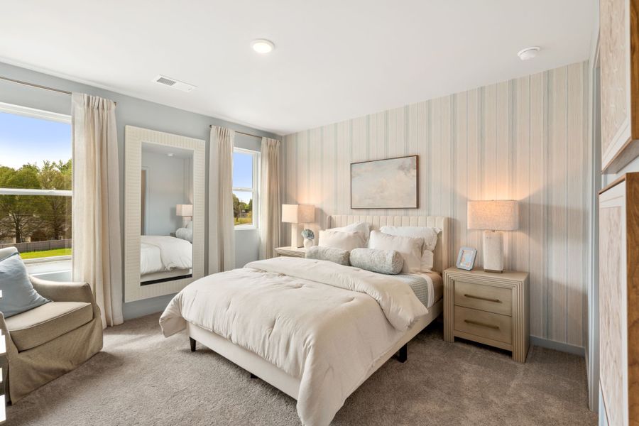 A bedroom with a large bed.