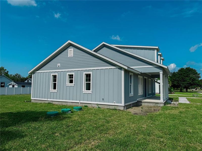 Front exterior of a new home in , Lake Helen, FL, highlighting curb appeal (Image 26). Front exterior of a new home in , Lake Helen, FL, highlighting curb appeal (Image 26).