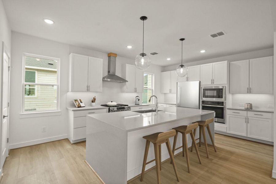 Island kitchen overlooking dining area and great room (*Photo not of actual home and used for illustration purposes only.) Island kitchen overlooking dining area and great room (*Photo not of actual home and used for illustration purposes only.)