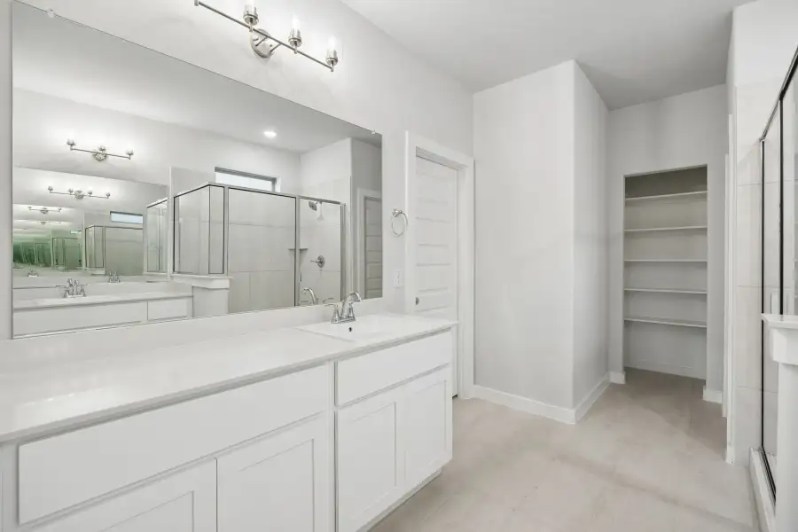 Primary Bathroom in the Winters home plan by Trophy Signature Homes – REPRESENTATIVE PHOTO