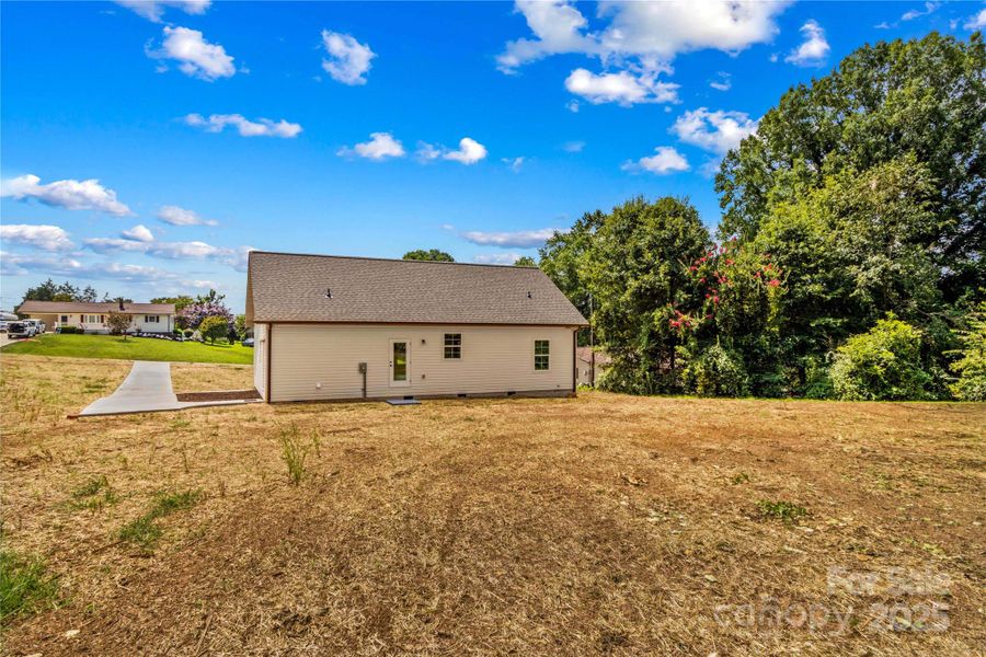Front exterior of a new home in , Statesville, NC, highlighting curb appeal (Image 15).