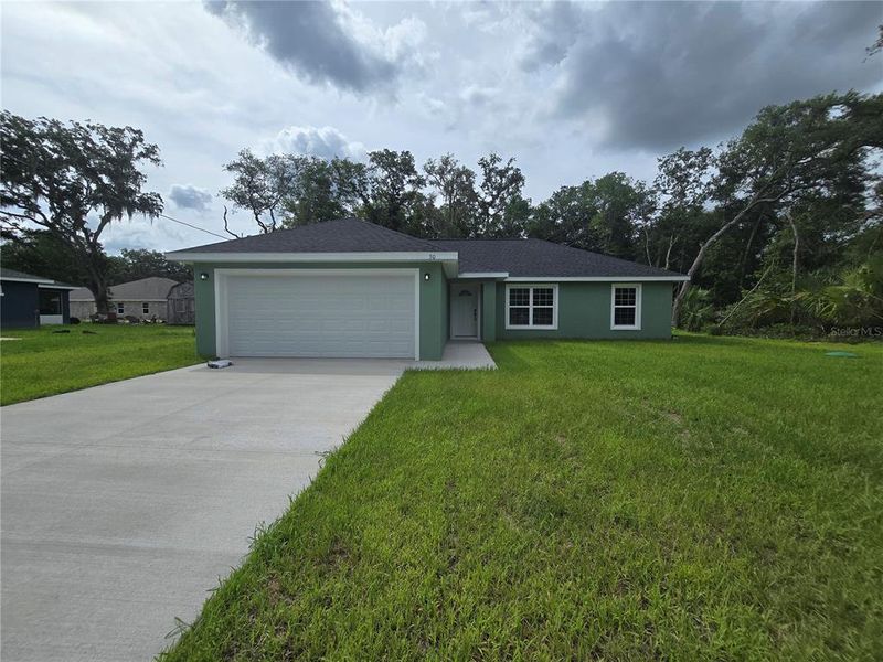 Front exterior of a new home in , Ocklawaha, FL, highlighting curb appeal (Image 2). Front exterior of a new home in , Ocklawaha, FL, highlighting curb appeal (Image 2).