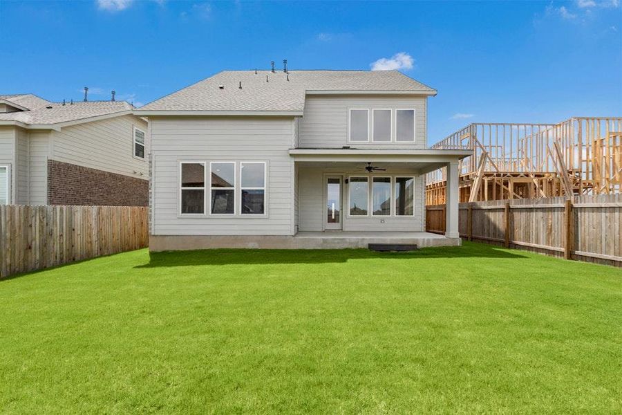 Front exterior of a new home in Santa Rita Ranch, Liberty Hill, TX, highlighting curb appeal (Image 2). Front exterior of a new home in Santa Rita Ranch, Liberty Hill, TX, highlighting curb appeal (Image 2).