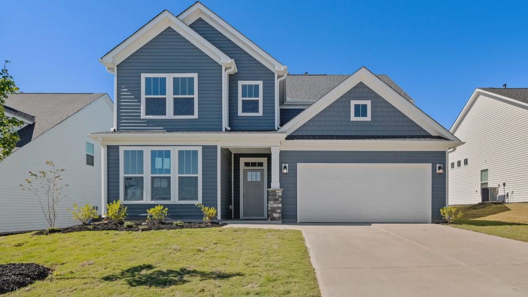 Representative exterior photo of a completed home built from the Drayton by DRB Homes in Woodglen, Piedmont, SC (Image 18).