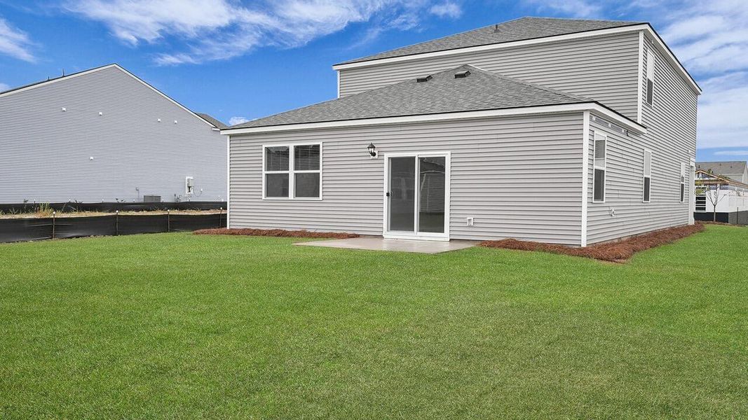 Exterior details and patio area of a home in Pine Hills at Cane Bay, Summerville (Image 23).