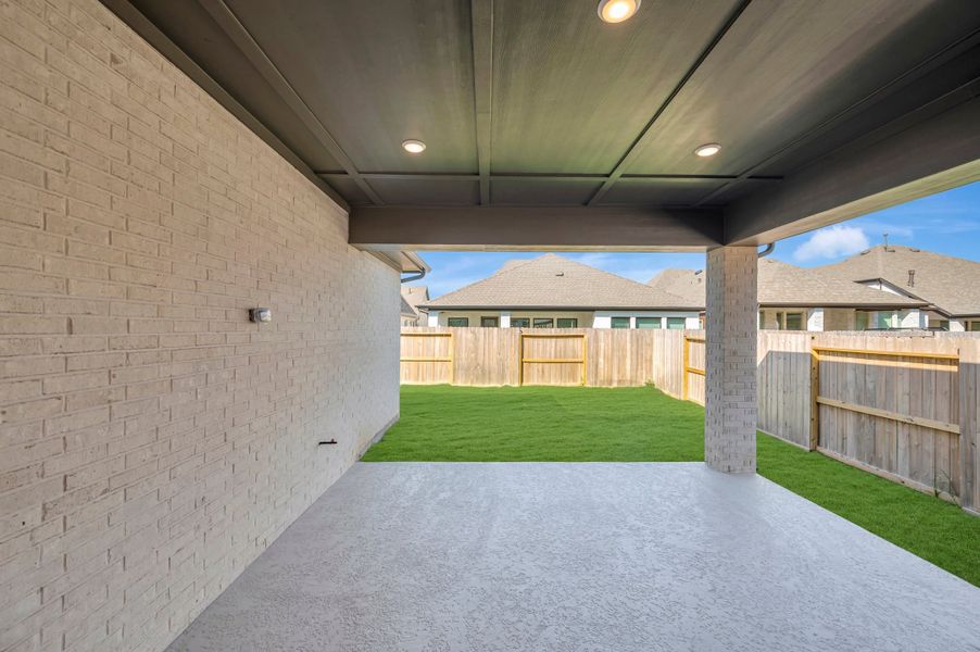 Exterior details and patio area of a home in Riceland - Enclave Collection, Mont Belvieu (Image 3). Exterior details and patio area of a home in Riceland - Enclave Collection, Mont Belvieu (Image 3).