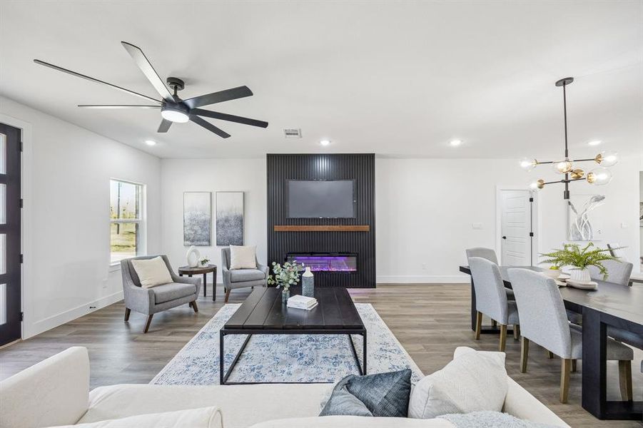 The electric fireplace is the centerpiece of the living room