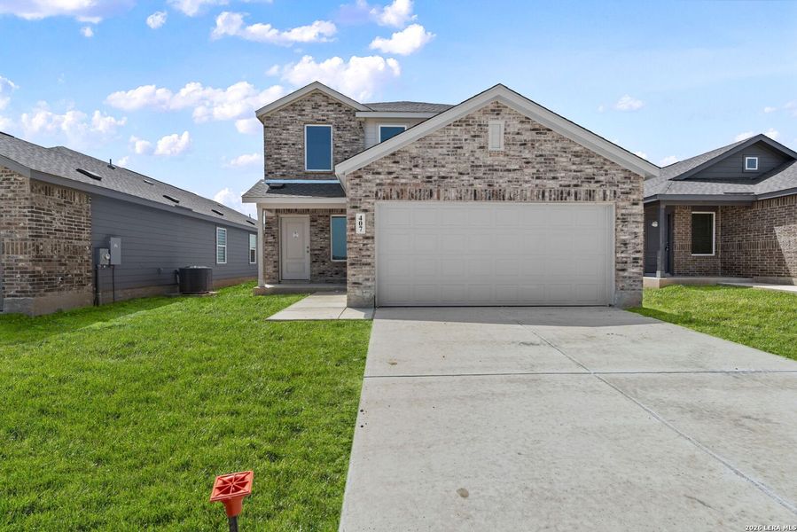 Front exterior of a new home in Guadalupe Ridge, New Braunfels, TX, highlighting curb appeal (Image 1). Front exterior of a new home in Guadalupe Ridge, New Braunfels, TX, highlighting curb appeal (Image 1).