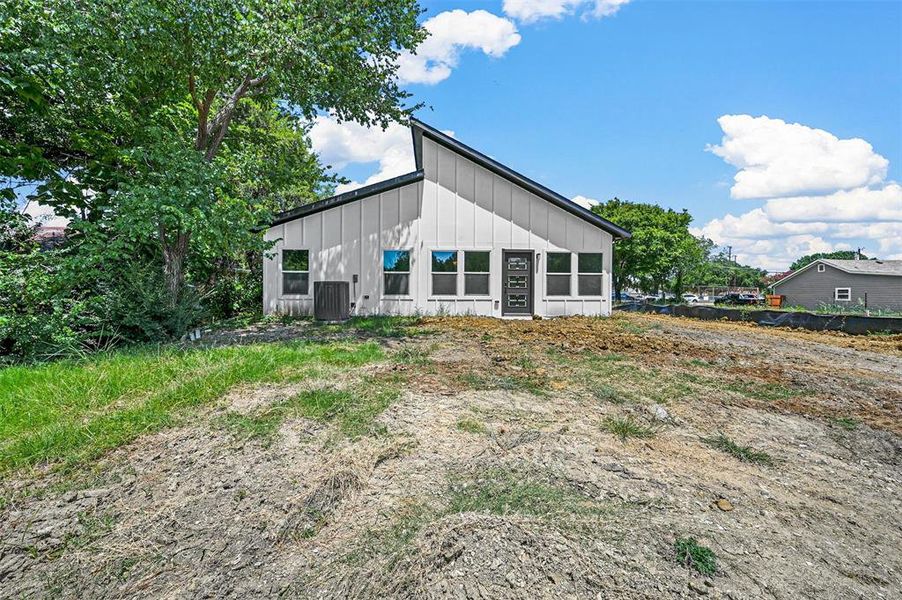 Back of house featuring central AC unit