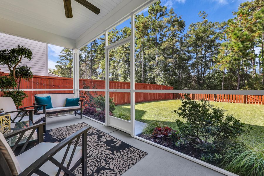 Exterior details and patio area of a home in Jasmine Point at Lakes of Cane Bay, Summerville (Image 1).