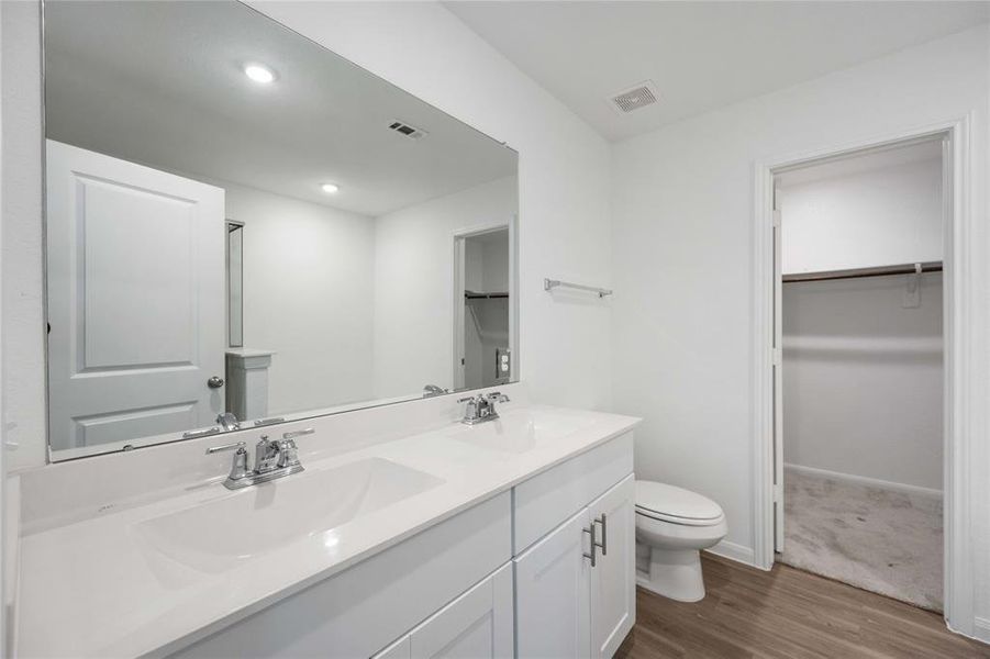 Primary ensuite bathroom with dual sinks!