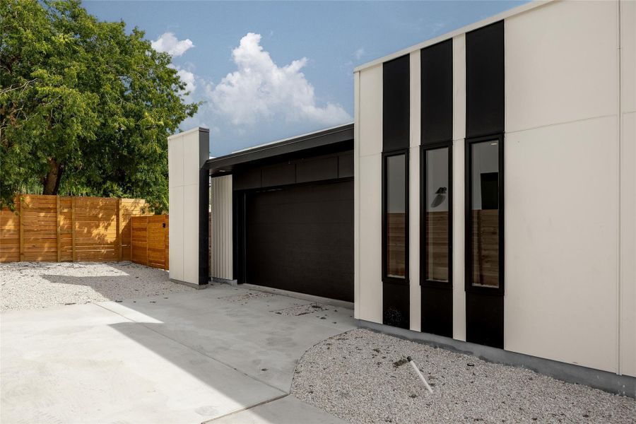 Garage featuring driveway