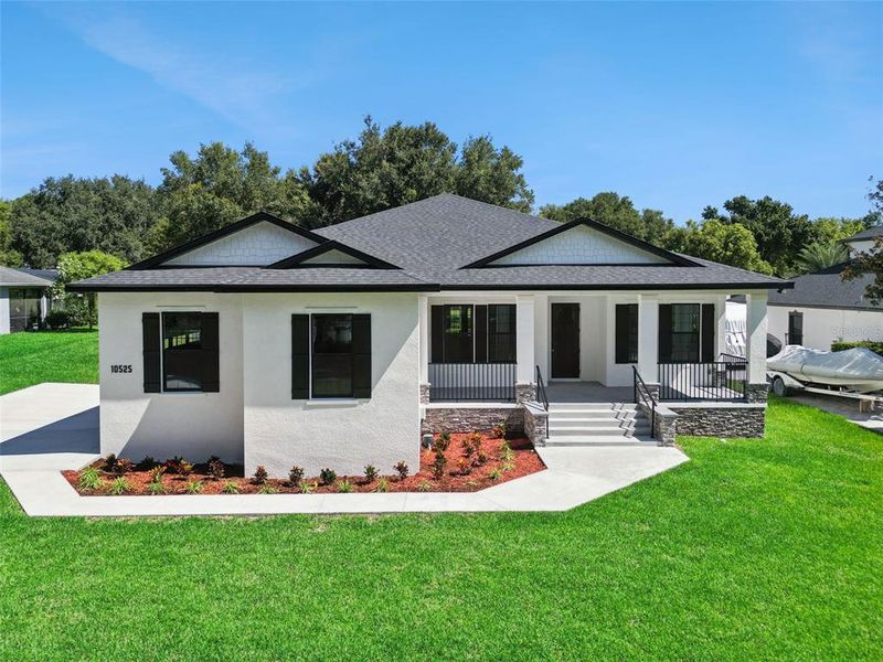 Front exterior of a new home in , Clermont, FL, highlighting curb appeal (Image 26).