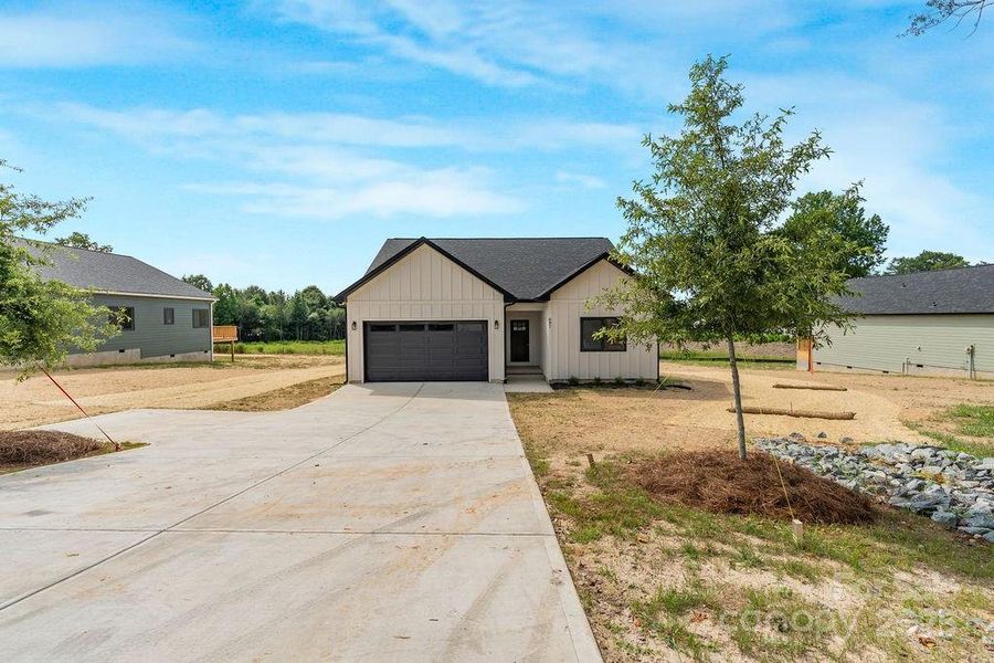 Front exterior of a new home in , Lincolnton, NC, highlighting curb appeal (Image 2).