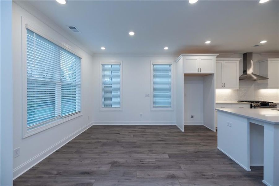 Dining area is off of the kitchen and family room for true open concept. Pictures represent a previously built home not the actual home, home is under construction.