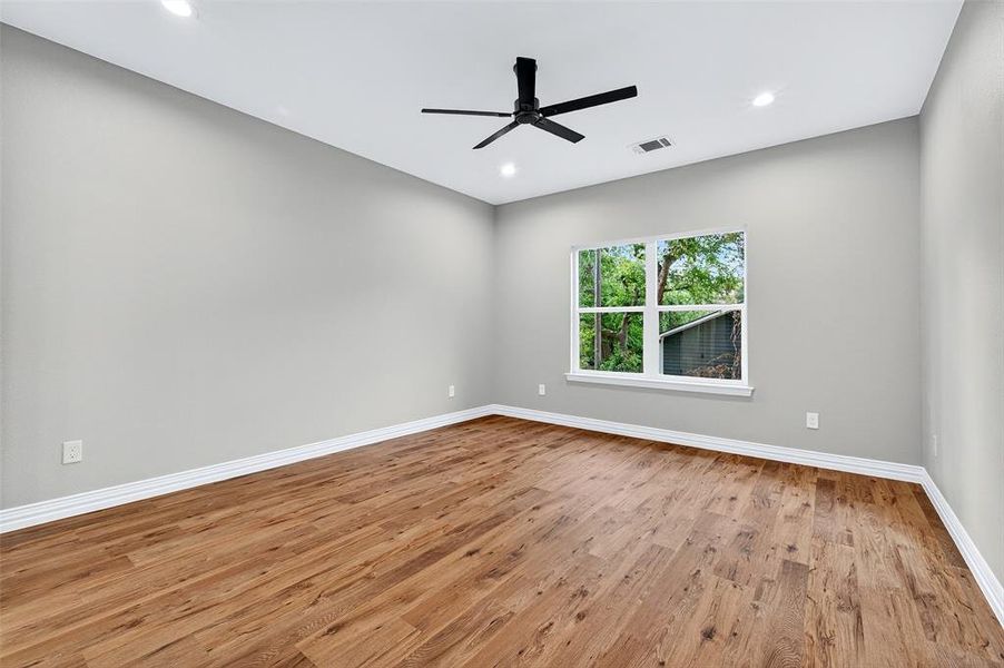 Spare room featuring light wood-type flooring, recessed lighting, and a ceiling fan Spare room featuring light wood-type flooring, recessed lighting, and a ceiling fan