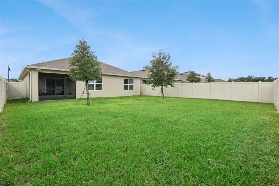 Exterior details and patio area of a home in Windrose, Apopka (Image 20).