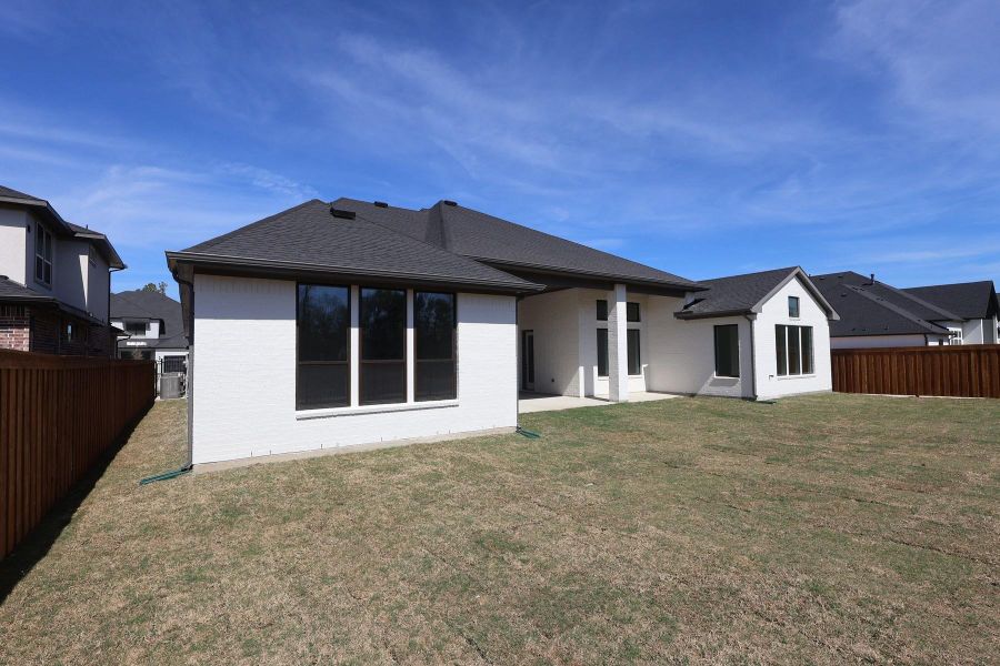 Exterior details and patio area of a home in Woodson’s Reserve, Spring (Image 4).