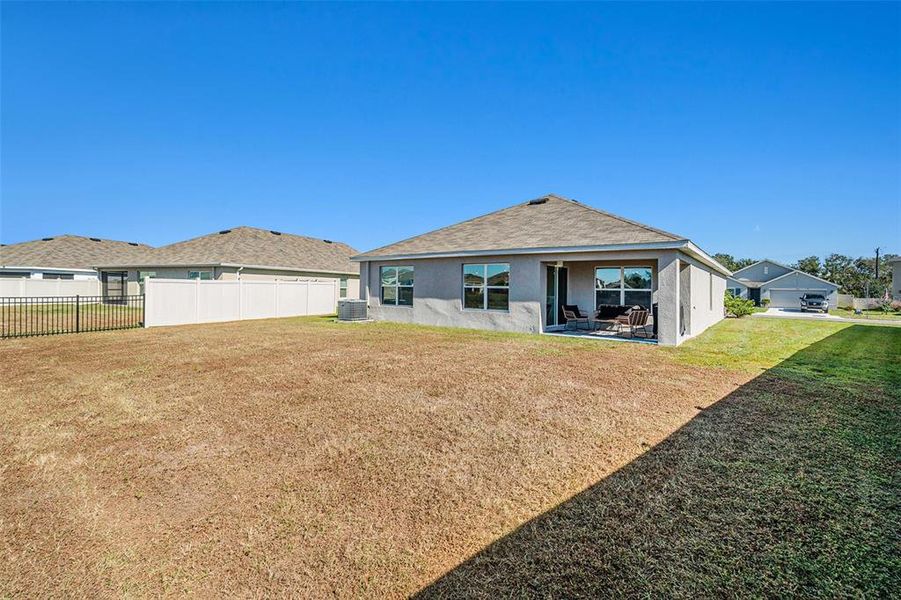 Exterior details and patio area of a home in Bella Lago, Parrish (Image 24).