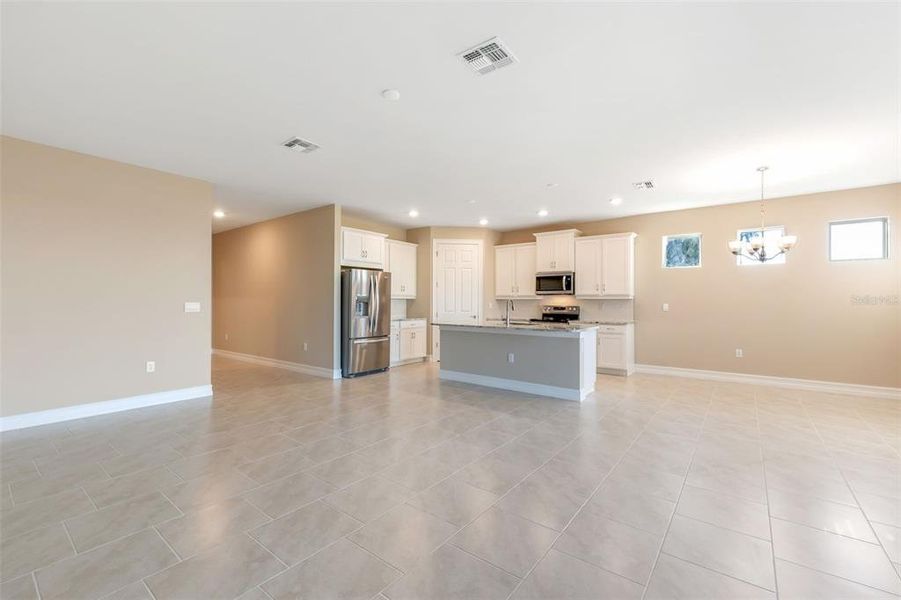 Spacious, unfurnished interior of a new home in Deep Creek Tradition Series, Punta Gorda (Image 17).