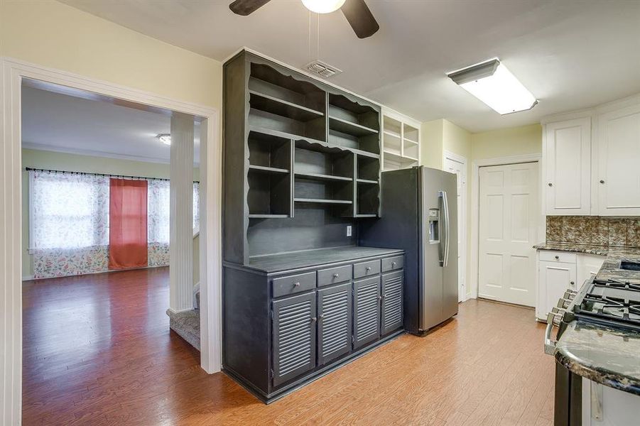 Door that goes to downstairs primary and easy access to large formal dining room. Door that goes to downstairs primary and easy access to large formal dining room.