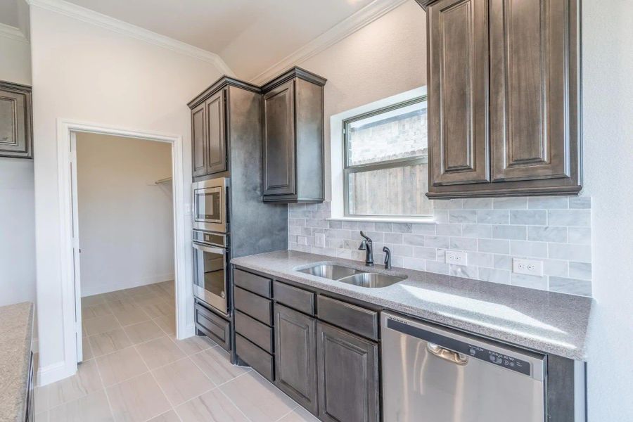 Kitchen | Concept 2027 at Abe's Landing in Granbury, TX by Landsea Homes