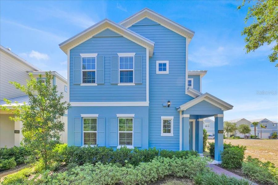 Front exterior of a new home in , Reunion, FL, highlighting curb appeal (Image 2).