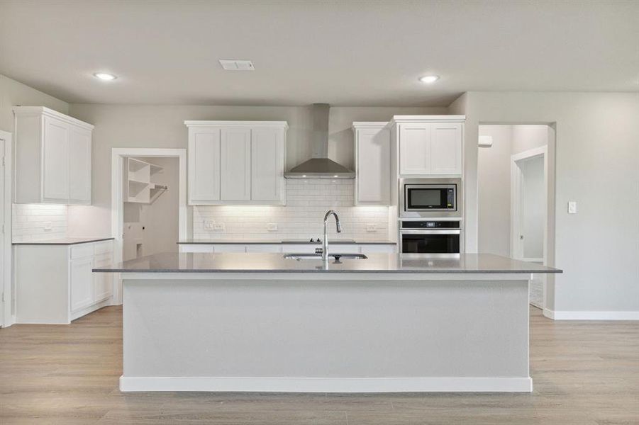 Kitchen in the Henley home plan by Trophy Signature Homes – REPRESENTATIVE PHOTO Kitchen in the Henley home plan by Trophy Signature Homes – REPRESENTATIVE PHOTO