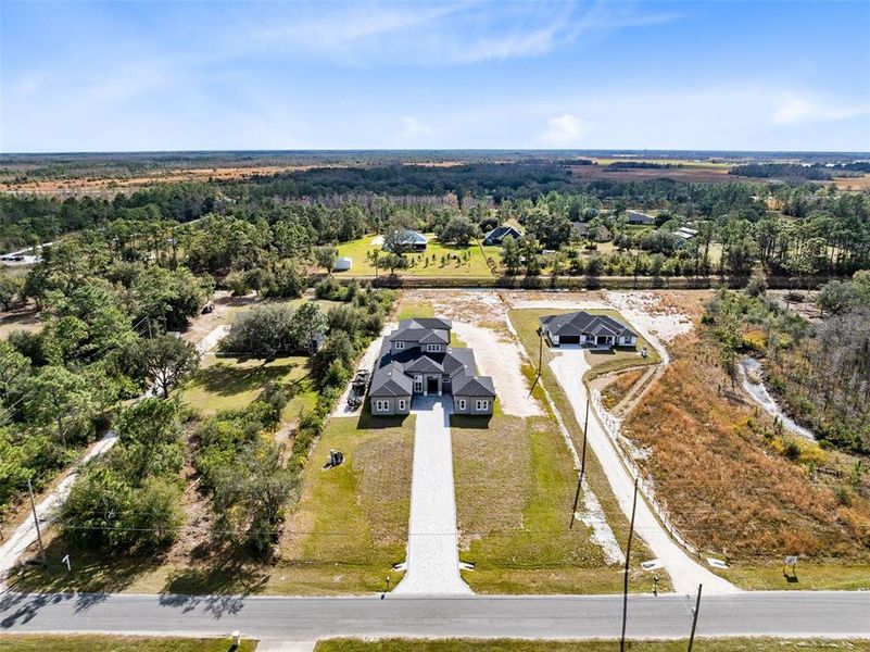 Aerial view of the front drive leading up to the home.