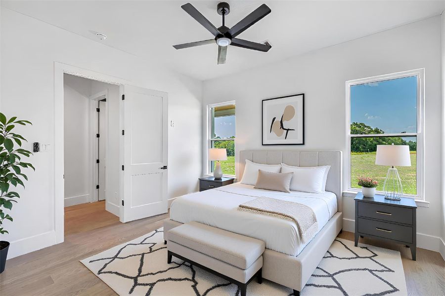 Bedroom featuring light wood finished floors and ceiling fan